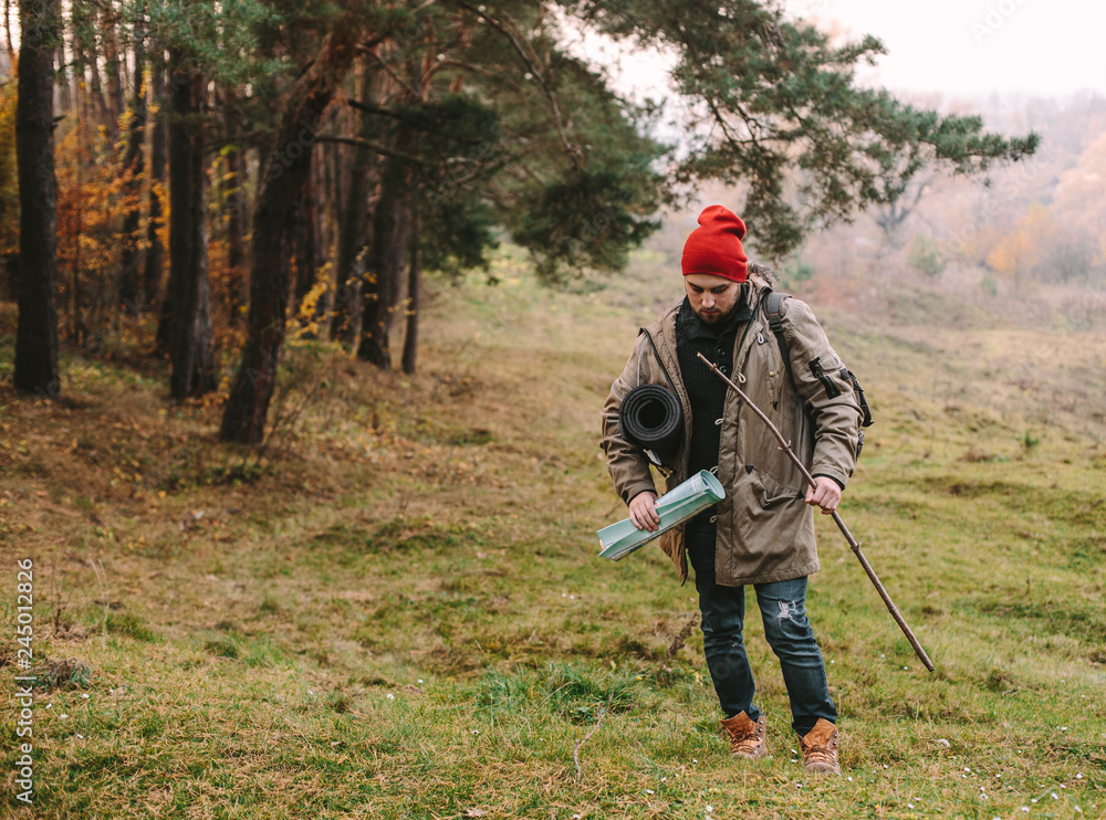 Young blogger photographer travel in mountain forest Young blogger photographer travel in mountain forest