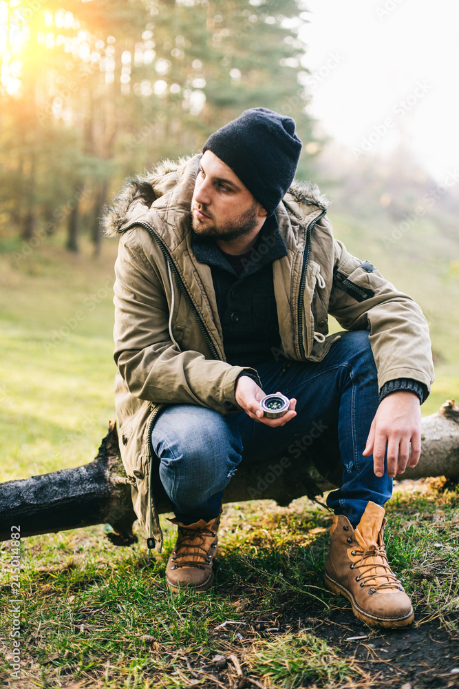 Fototapeta premium Young blogger photographer travel in mountain forest