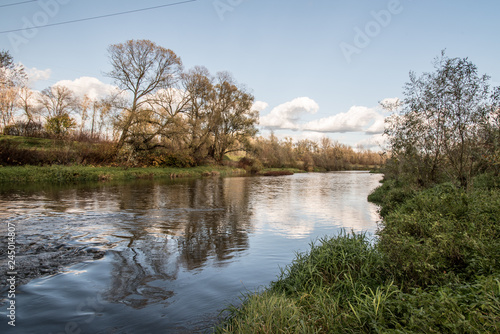 Olse river near Karvina city in Czech republic during nice autumn day photo