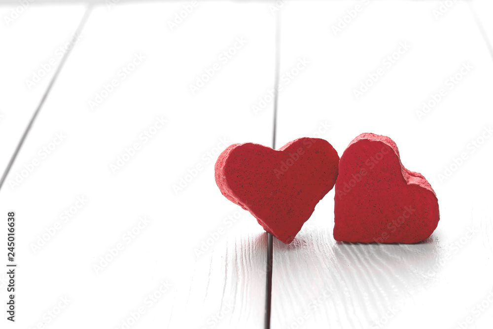 two hearts on white wooden background with place text two hearts on white wooden background with place text