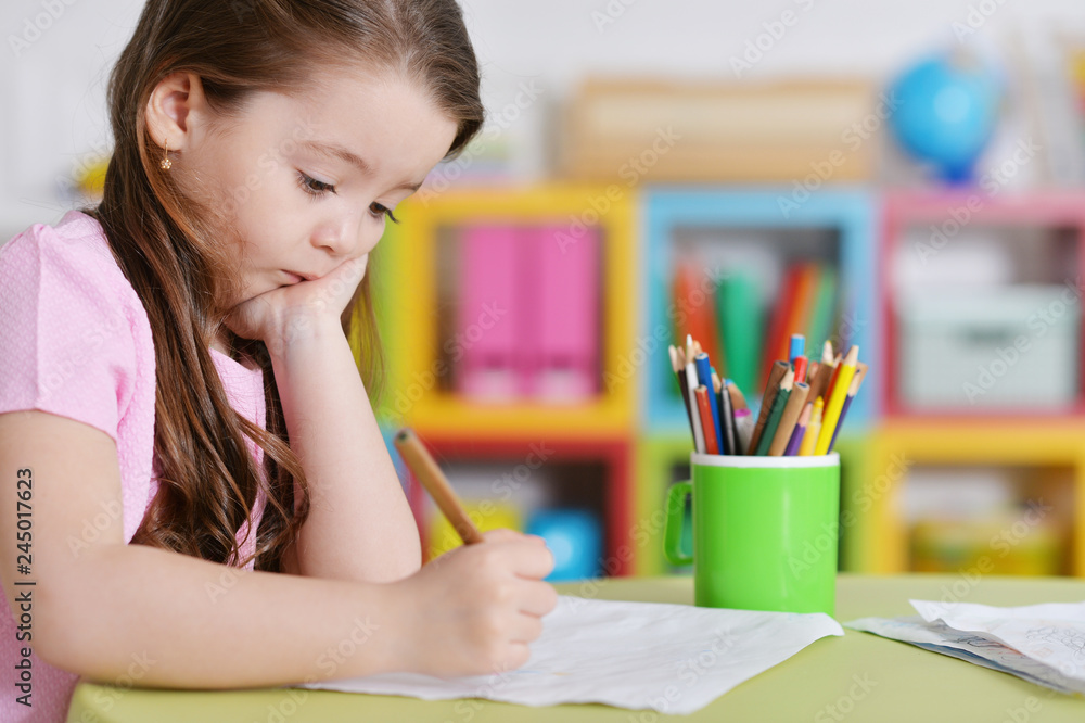 Cute little girl in pink shirt drawing Cute little girl in pink shirt drawing