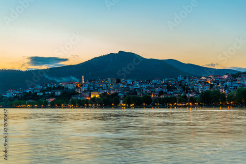 Sunset over kastoria, Greece photo