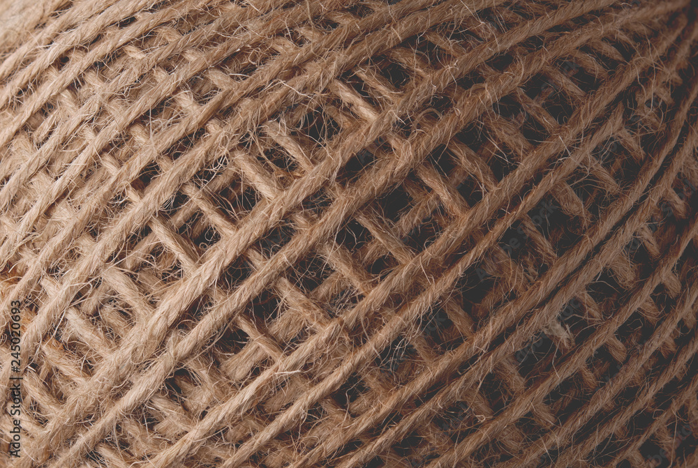 skein of jute thread texture. micro shot of a coil of jute twine skein of jute thread texture. micro shot of a coil of jute twine