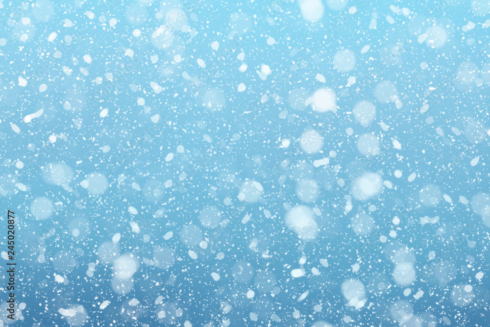 Snow falls on winter blue sky background Snow falls on winter blue sky background