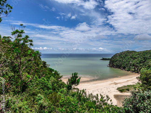 A hidden beach in Borneo, Bako National Park, Malaysia. Seen from a high situated viewing point. Hidden paradise. Beautiful destination for holidays. Beach surrounded by forest and cliffs.
