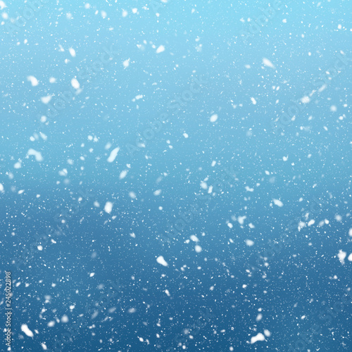 Snow falls on winter blue sky background