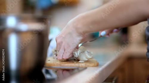 cooking chicken legs, woman in kitchen cooking