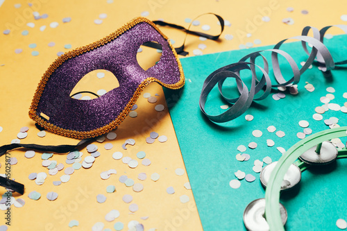 Brazilian Carnival concept. Mask and confetti on over background