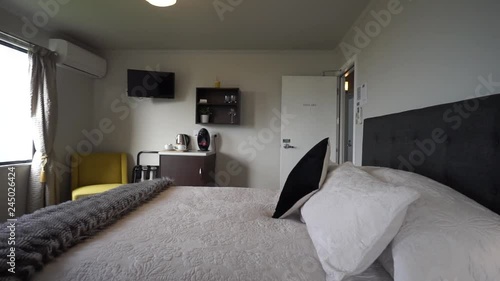 SLOWMO - Luxury modern boutiqe hotel room double queensize bed with lamps, ocean sea view photo