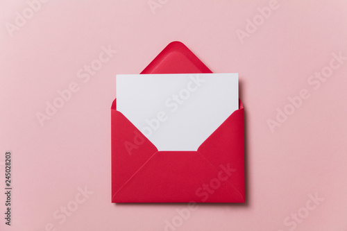 Blank white card with red paper envelope template mock up photo