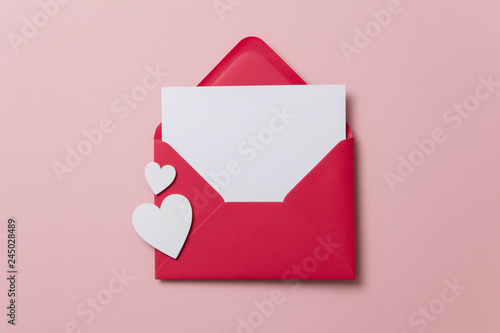 Love letter. white card with red paper envelope mock up photo