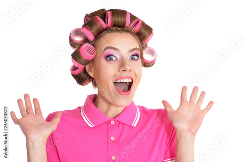 portrait of young woman in hair curlers posing