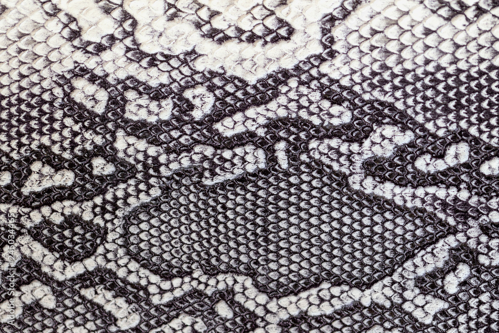 Snakeskin pattern on genuine leather close-up, imitation of exotic reptile, trendy background Snakeskin pattern on genuine leather close-up, imitation of exotic reptile, trendy background
