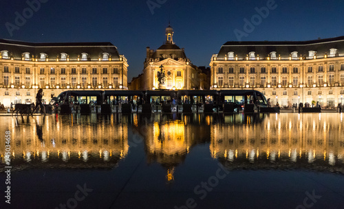 Tram stoped at place de la bourse in downtown Bordeaux at night