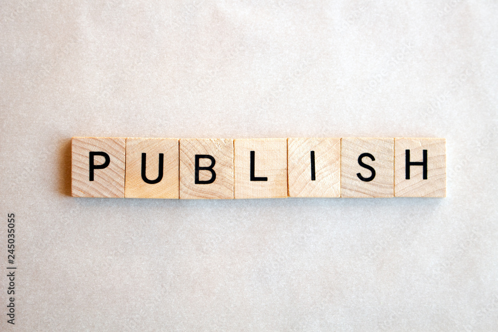 The word Publish written in wooden block letters on a white background. Business and education concepts The word Publish written in wooden block letters on a white background. Business and education concepts