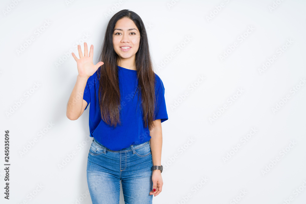 Beautiful brunette woman over isolated background showing and pointing up with fingers number five while smiling confident and happy. Beautiful brunette woman over isolated background showing and pointing up with fingers number five while smiling confident and happy.