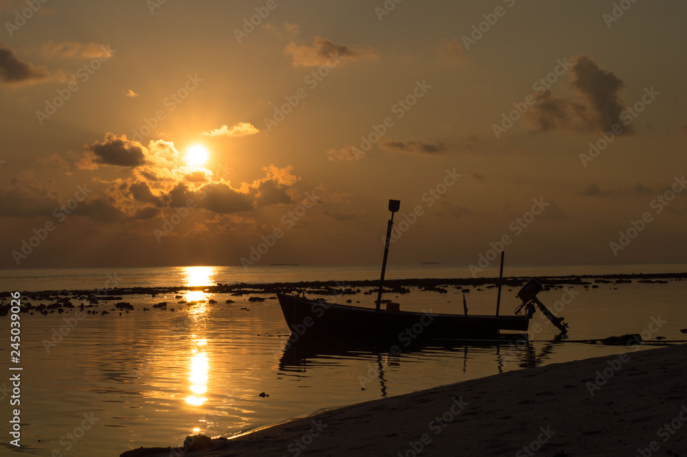 Sunset on the Sea with a boat