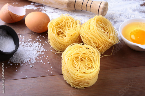 egg, flour, salt ingredients for pasta spaghetti. Cooking concept. Top view. photo