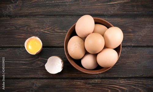 A plate of yellow eggs on a wooden background