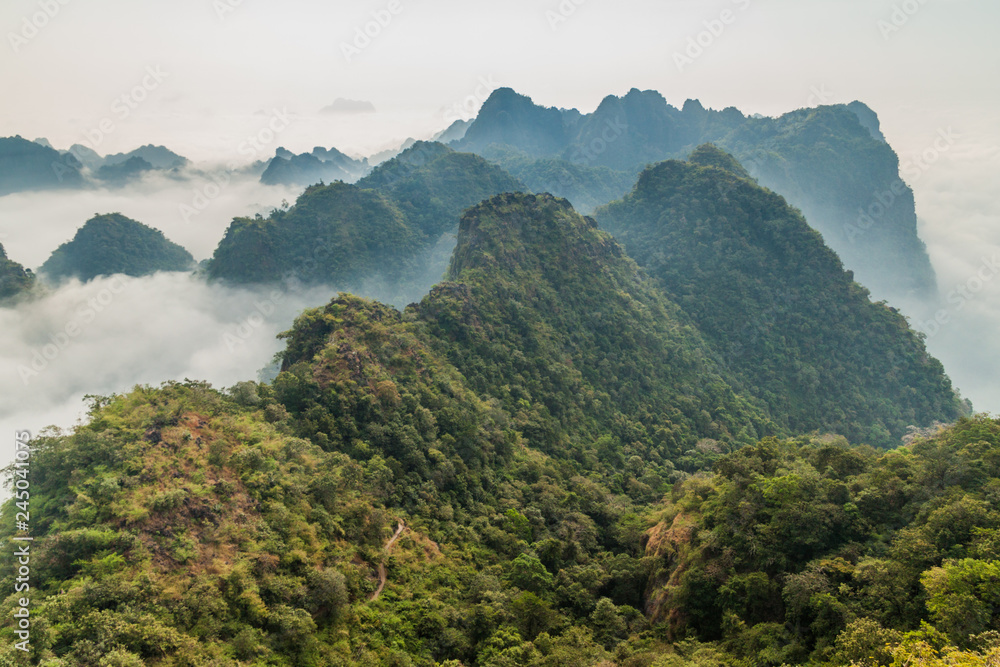 Mountains around Mt Zwegabin in a mist near Hpa An, Myanmar