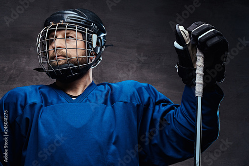 Photography Portrait of a professional ice-hockey player in a hockey uniform