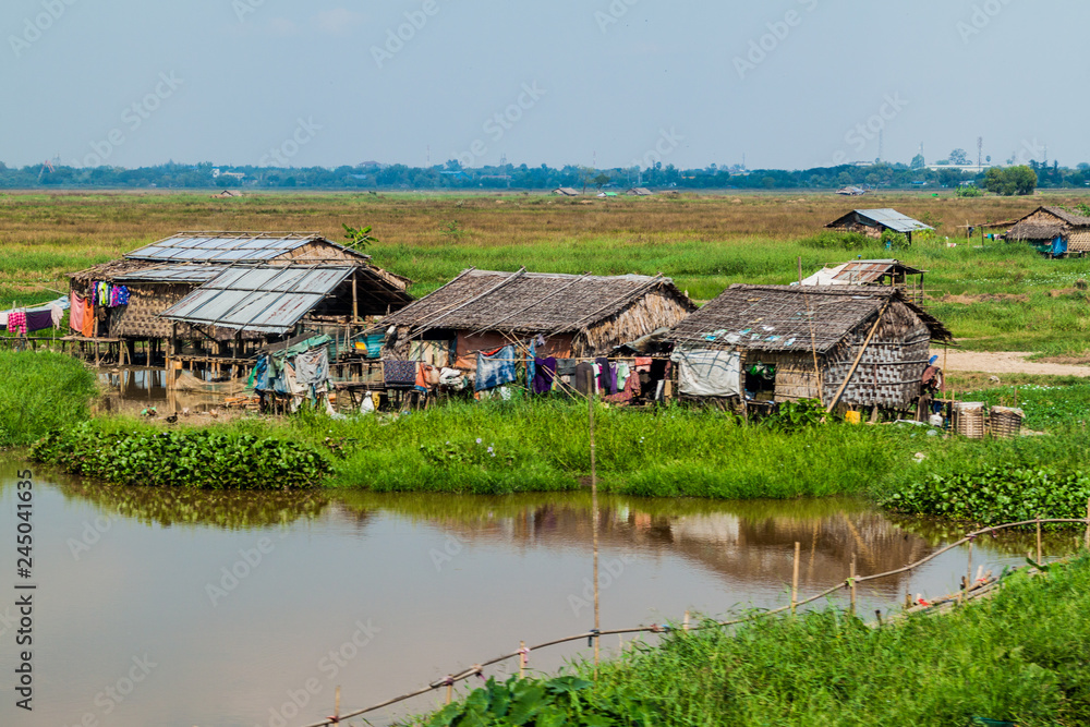 Fields and houses in a suburbs of Yangon, Myanmar Fields and houses in a suburbs of Yangon, Myanmar