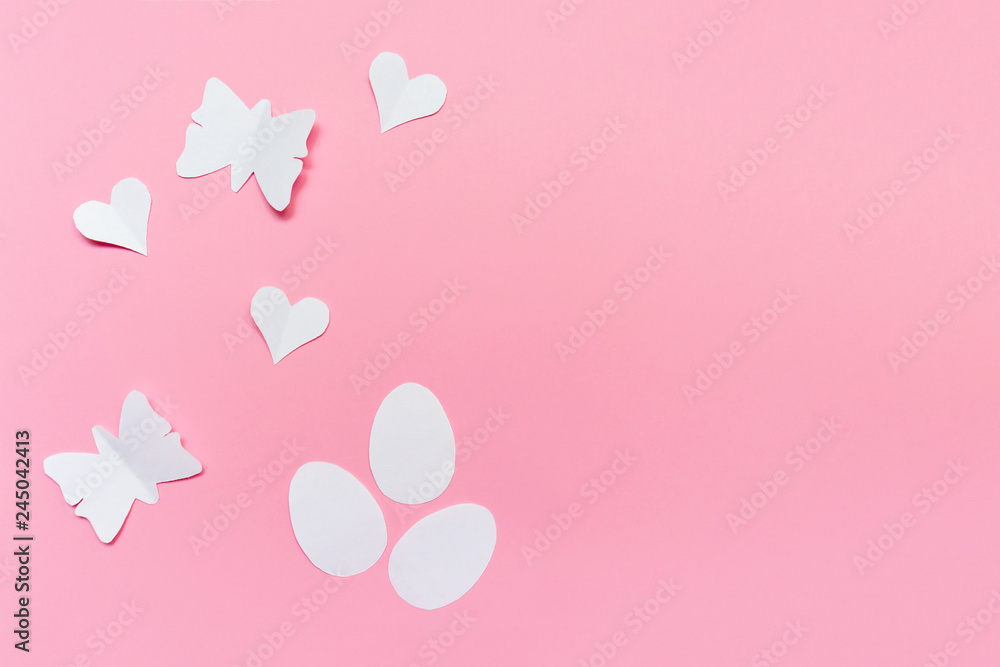 Three white easter eggs, hearts and butterflies cut of paper on pink background, easter and spring concept wiyh copy space