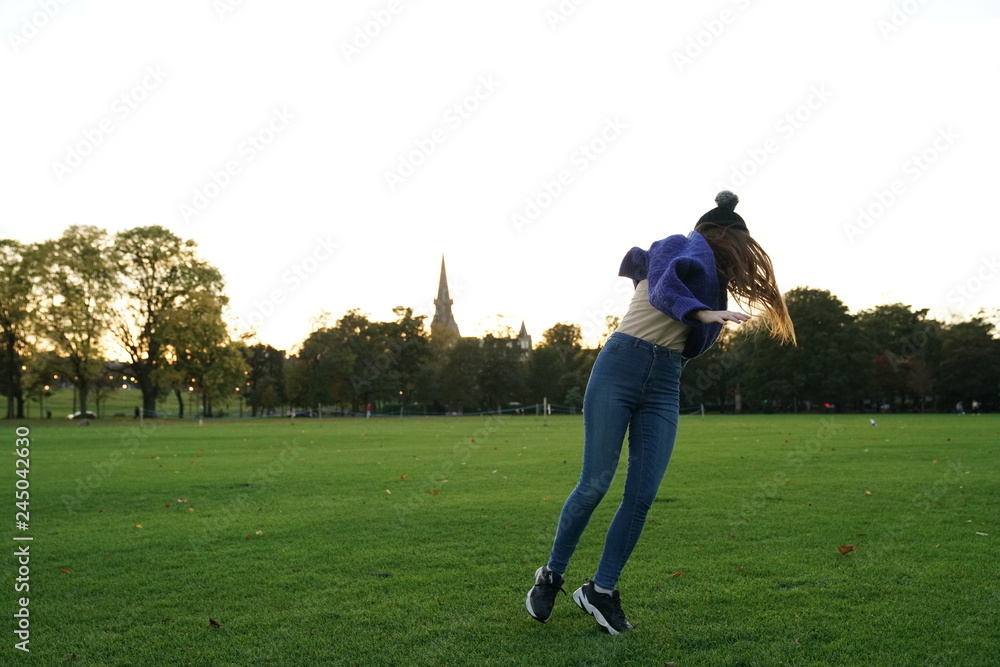 young woman pirouettes