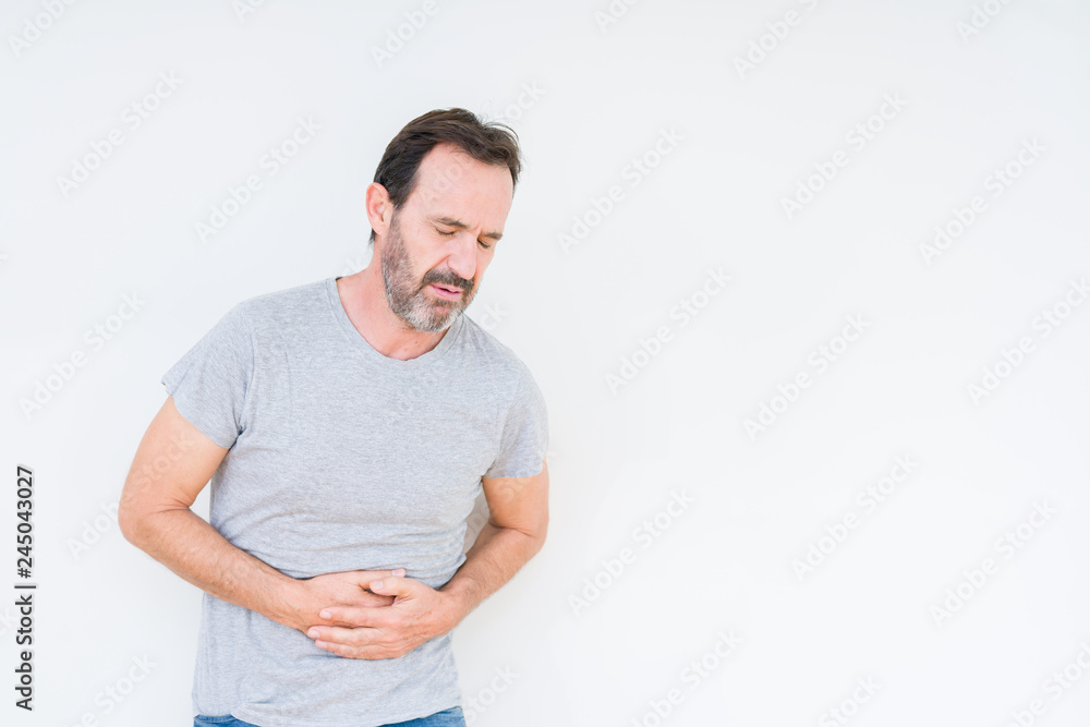 Handsome senior man over isolated background with hand on stomach because nausea, painful disease feeling unwell. Ache concept. Handsome senior man over isolated background with hand on stomach because nausea, painful disease feeling unwell. Ache concept.