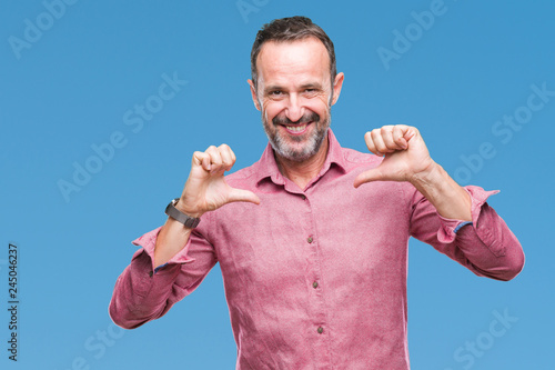 Middle age hoary senior man over isolated background looking confident with smile on face, pointing oneself with fingers proud and happy.
