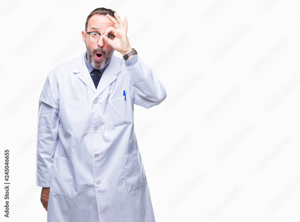 Middle age senior hoary professional man wearing white coat over isolated background doing ok gesture shocked with surprised face, eye looking through fingers. Unbelieving expression. Middle age senior hoary professional man wearing white coat over isolated background doing ok gesture shocked with surprised face, eye looking through fingers. Unbelieving expression.