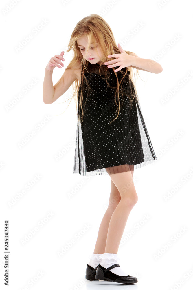 Little girl in a dress developing in the wind. Little girl in a dress developing in the wind.