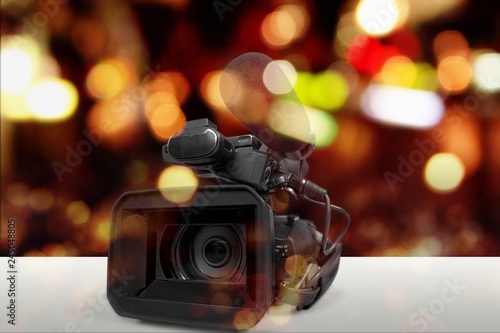 Professional video camera on white background