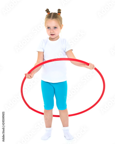 The little girl turns the hoop.