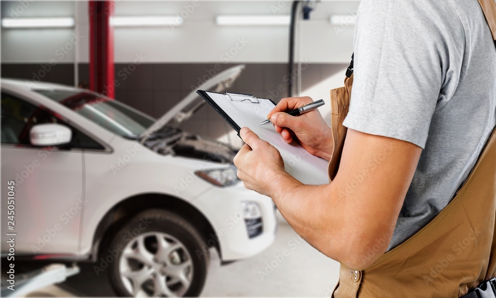 Auto Repair Shop, Male Mechanic near Car