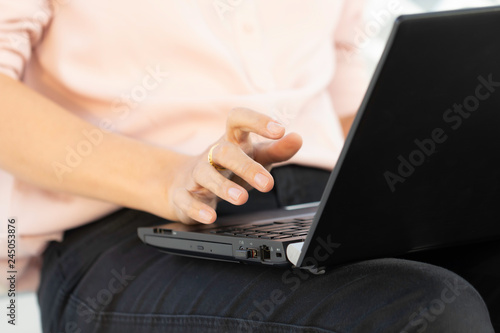 Business woman hand working and typing on laptop computer.