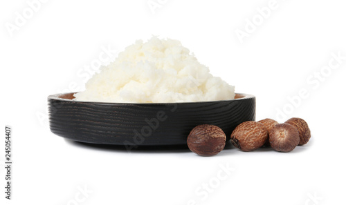 Fototapeta Naklejka Na Ścianę i Meble -  Shea butter in bowl and nuts isolated on white