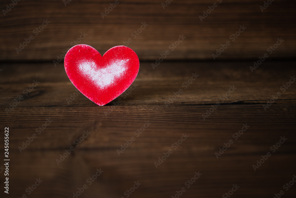 Fototapeta premium red heart on wooden background. Valentine's Day. celebration