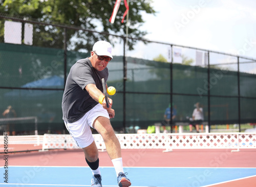 A gentleman competes in a pickleball tournament