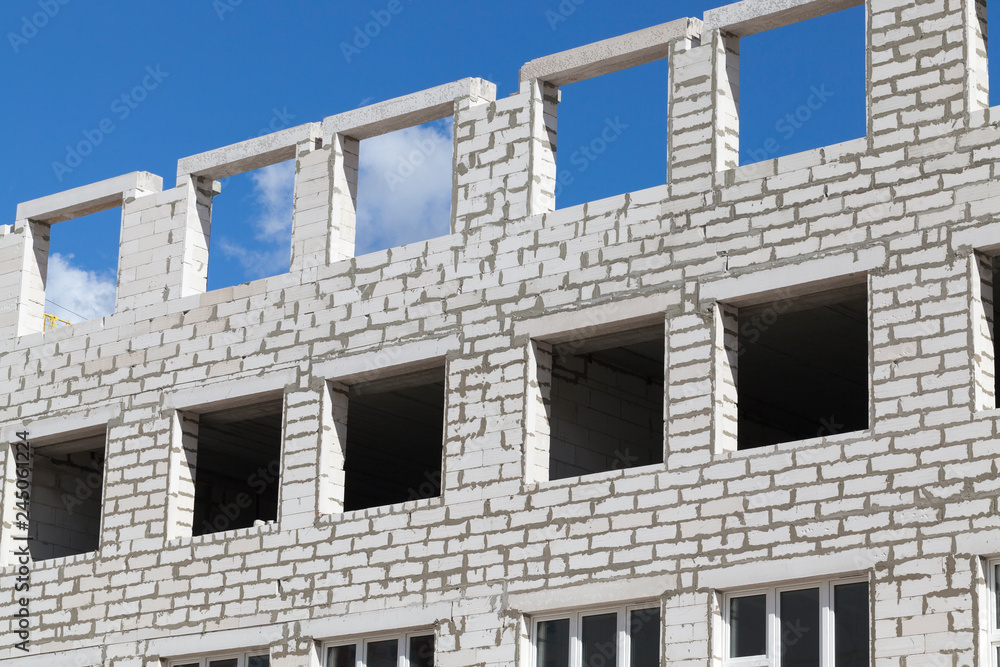 Fototapeta premium Brick building construction unfinished windows
