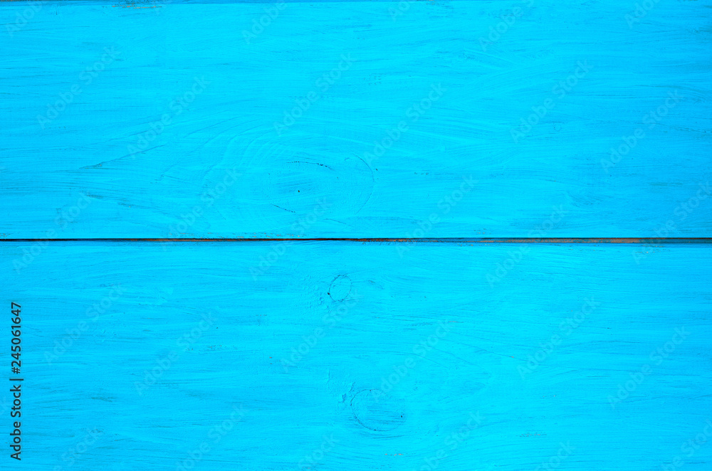 Uniform texture of light blue wooden boards close-up.