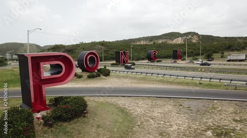 AERIAL: Revealing las letras from behind a bush.