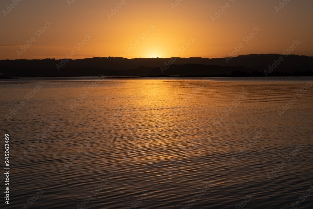 Naklejka premium sunset over estuary