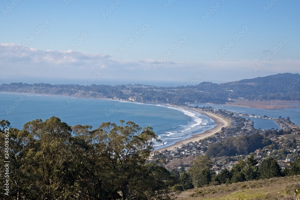 Bolinas Bay and beach on the north coast of California approxamitely 15 miles from San Fransico. typical haze from teh marine layer is on slight today.