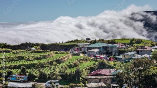 Sea of clouds on a town located on Mount Pulag, the third highest peak in Philippines. photo