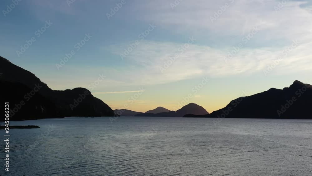 Aerial view of ocean sunset over mountains in beautiful British Columbia. Canada. 4K. Aerial view of ocean sunset over mountains in beautiful British Columbia. Canada. 4K.