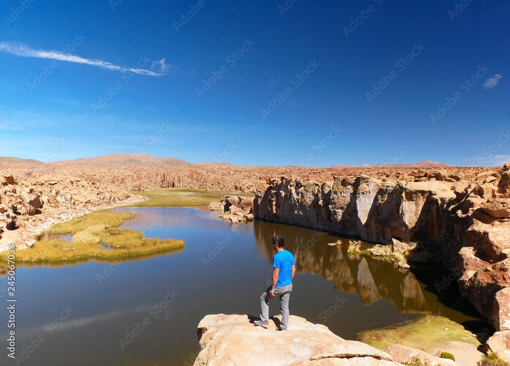 Tourist at Laguna escondida in Sur Lipez, Bolivia