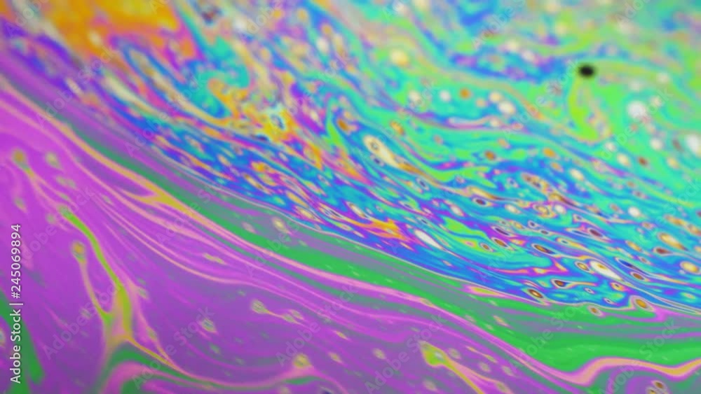 Psychedelic background of motion surface of colorful soap bubble Psychedelic background of motion surface of colorful soap bubble