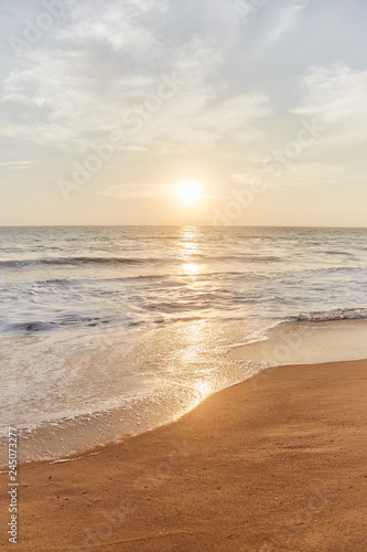 Fototapeta Naklejka Na Ścianę i Meble -  Narigama Beach. Stunning sunset on the beach overlooking the ocean and the waves.  