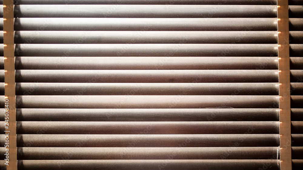 evening sun light outside with wooden window blinds, sunshine and shadow on window blind, decorative interior home concept evening sun light outside with wooden window blinds, sunshine and shadow on window blind, decorative interior home concept